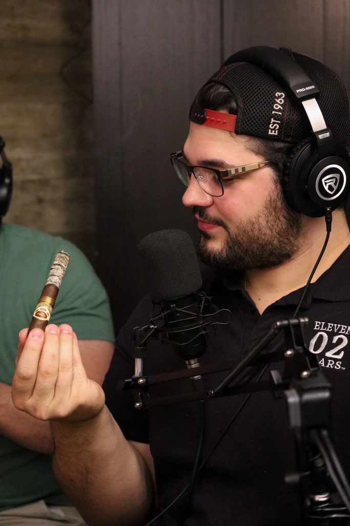 Zach showing off his ash on The Cigar Guys Podcast