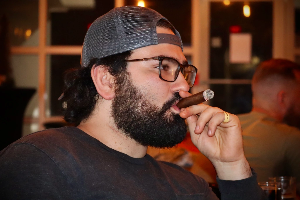 Mark smoking a cigar