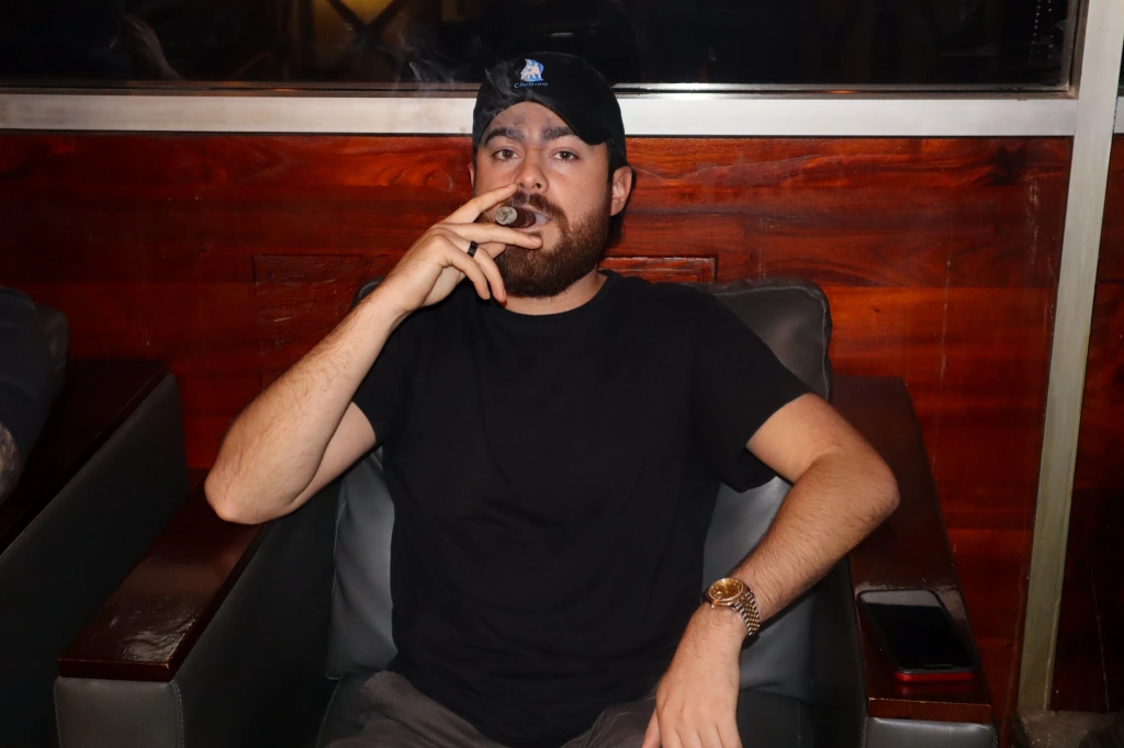 Alex smoking a cigar