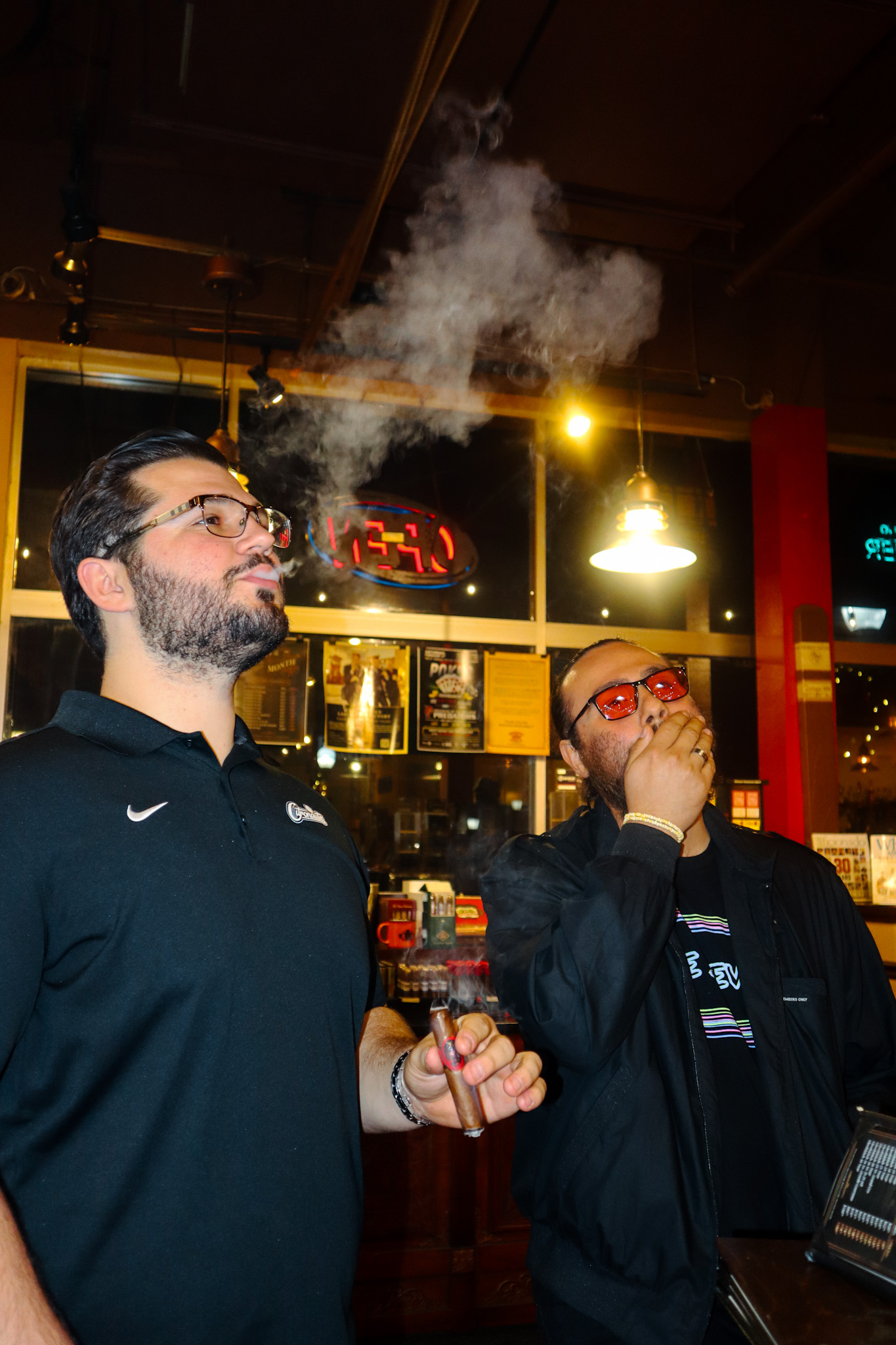 two men smoking cigars