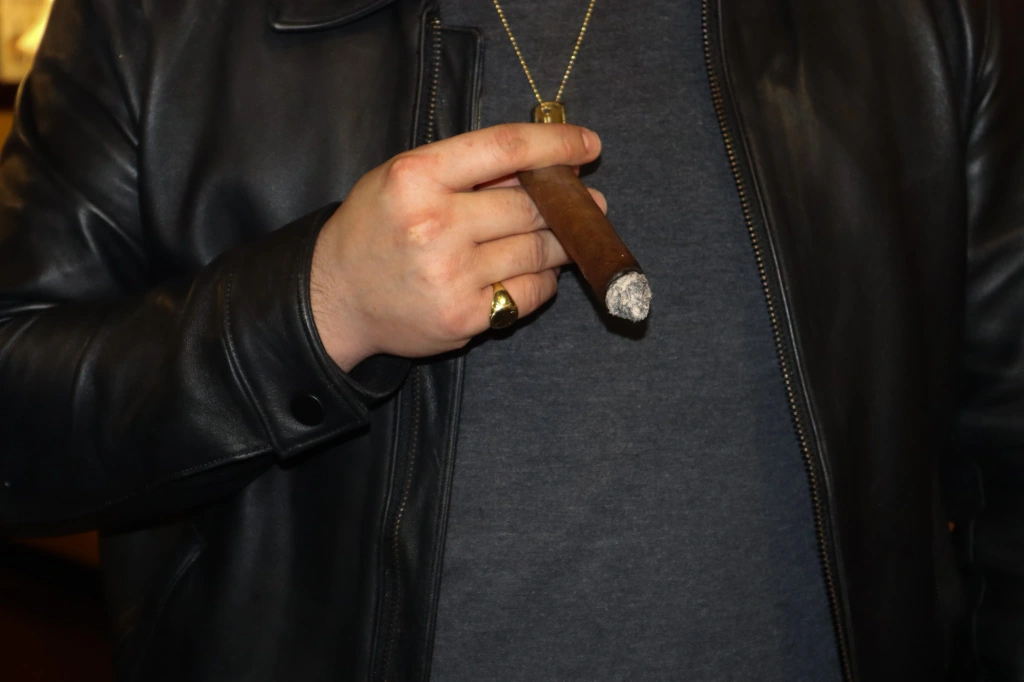 Jared smoking a cigar