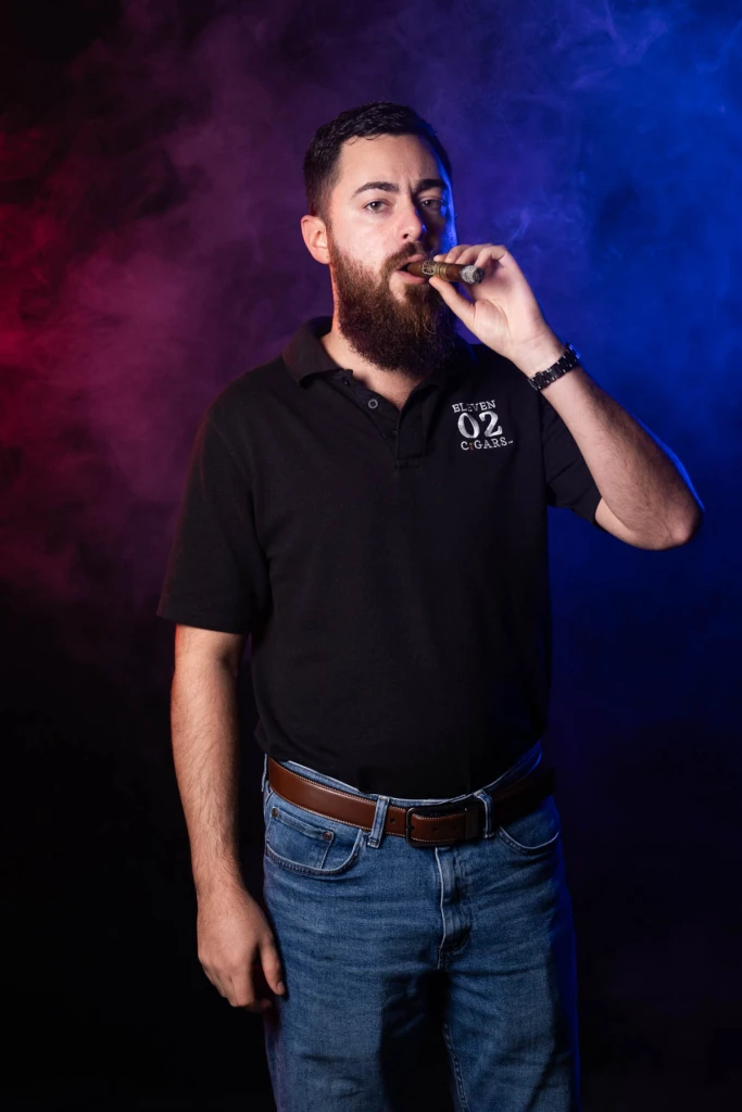 Alexander J. Gonzalez smoking a cigar