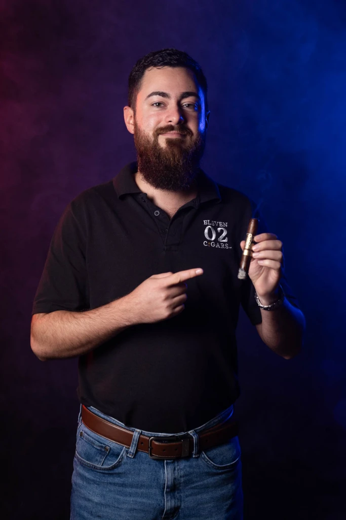 Alexander J Gonzalez holding a cigar