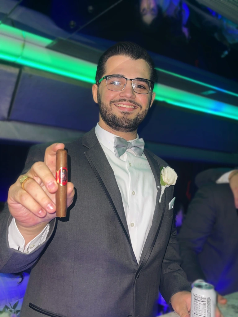 Zachary Nikollaj holding the Besa cigar